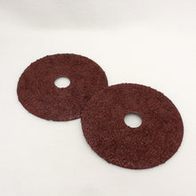 Aluminum oxide resin fiber sanding discs with hole in center.